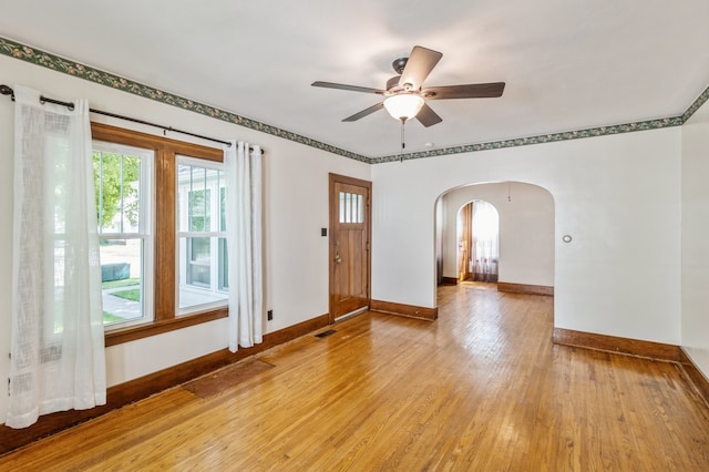 spare room with ceiling fan and light hardwood / wood-style flooring