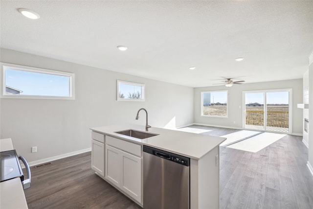 kitchen featuring sink, dark hardwood / wood-style flooring, stainless steel dishwasher, an island with sink, and white cabinets