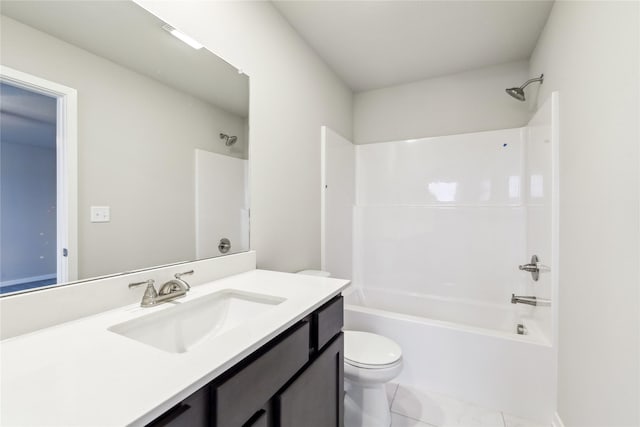 full bathroom with washtub / shower combination, tile patterned flooring, vanity, and toilet