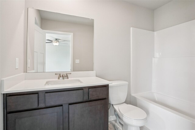 18025 Alpine Dr, Clive, IA 50325 - bathroom with vanity, toilet, a ceiling fan, and tub / shower combination