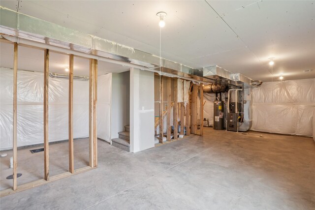 18025 Alpine Dr, Clive, IA 50325 - unfinished basement featuring heating unit, water heater, and stairs