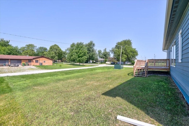 view of yard with a wooden deck