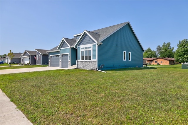 craftsman-style house featuring a garage, concrete driveway, stone siding, and a front yard