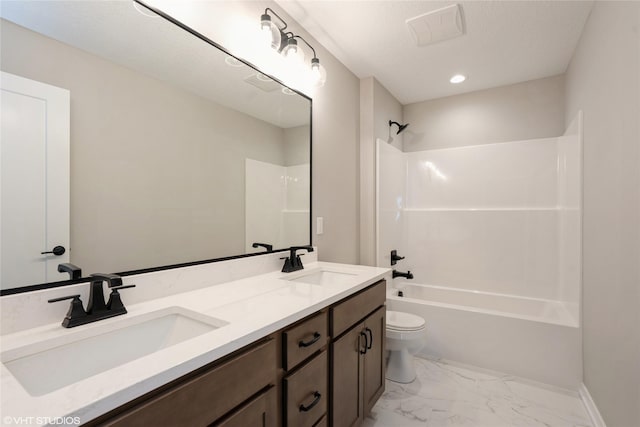 2750 SE Florence Dr, Waukee, IA 50263 - full bathroom with double vanity, toilet, washtub / shower combination, marble finish floors, and baseboards