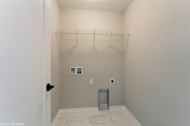 laundry room with electric dryer hookup, a textured ceiling, and hookup for a washing machine