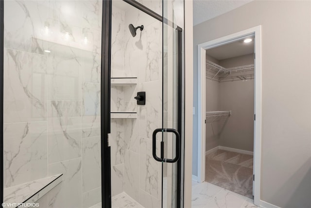 bathroom featuring a shower with shower door