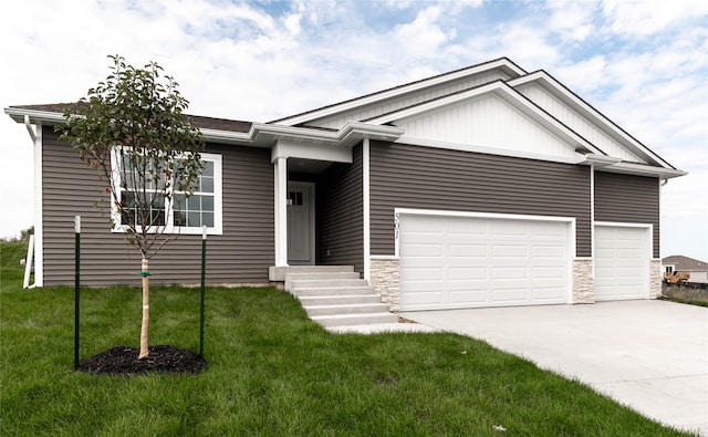 view of front of house with a front lawn and a garage