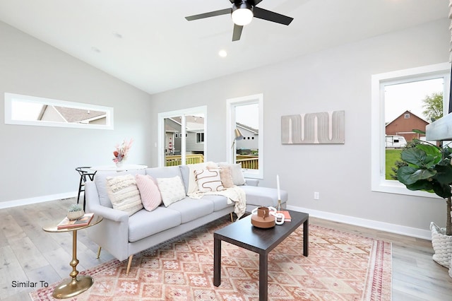 living room with recessed lighting, baseboards, lofted ceiling, and wood finished floors