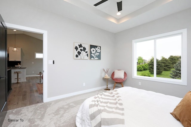 bedroom with carpet, baseboards, ceiling fan, recessed lighting, and a raised ceiling