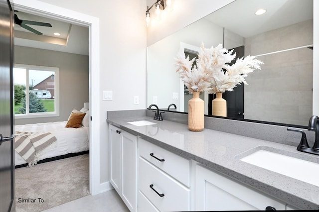 bathroom featuring double vanity, recessed lighting, a ceiling fan, and a sink