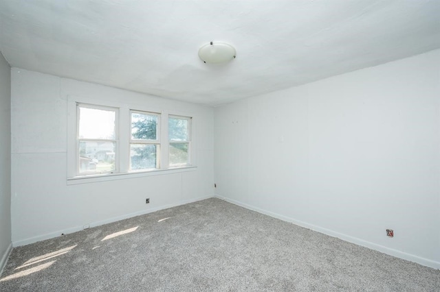 1125 Clinton Ave, Des Moines, IA 50313 - carpeted spare room with baseboards