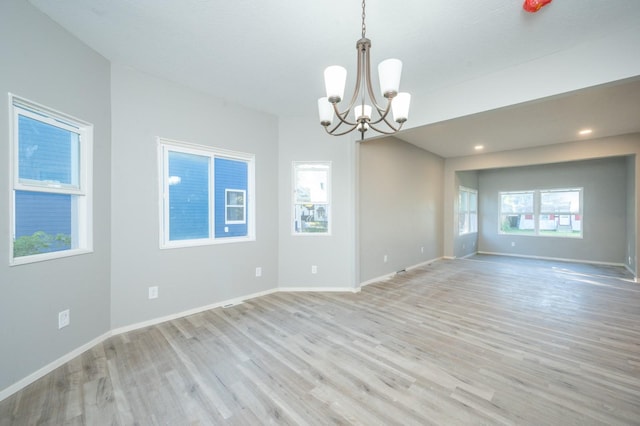 1125 Clinton Ave, Des Moines, IA 50313 - unfurnished room with a chandelier, light wood-style flooring, baseboards, and recessed lighting