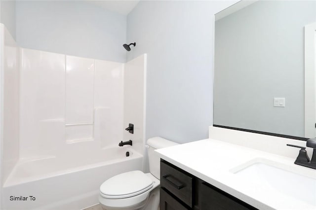 bathroom featuring toilet, bathtub / shower combination, and vanity