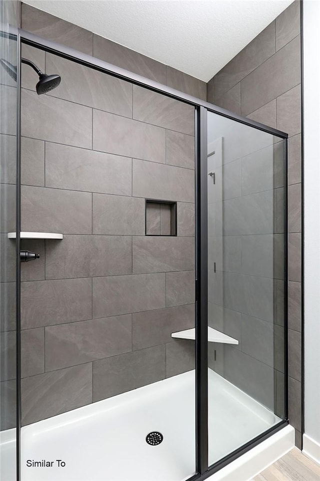 full bathroom with a shower stall