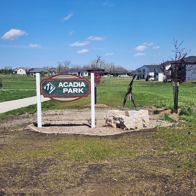 community sign with a yard