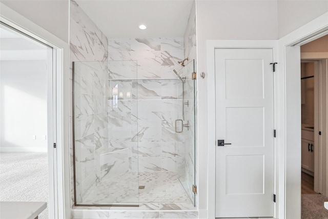 bathroom with a shower with shower door