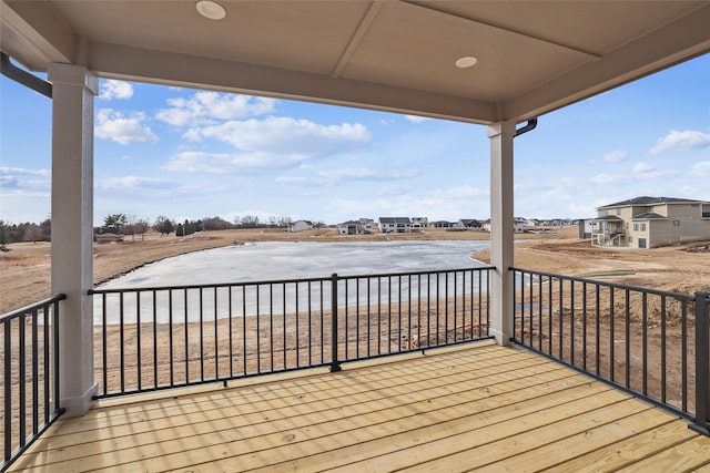 wooden terrace with a water view