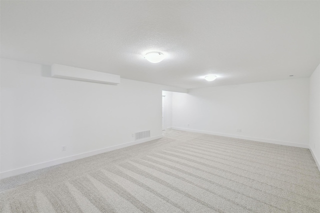 basement with light colored carpet