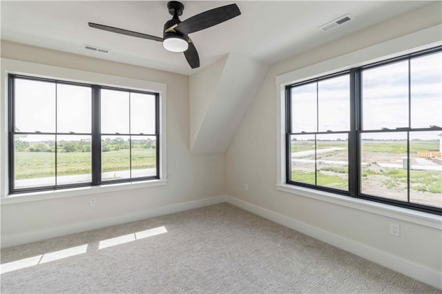 bonus room with baseboards, visible vents, ceiling fan, and carpet flooring