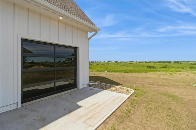 view of yard with a patio area and a rural view