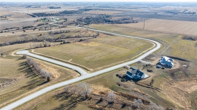 birds eye view of property featuring a rural view