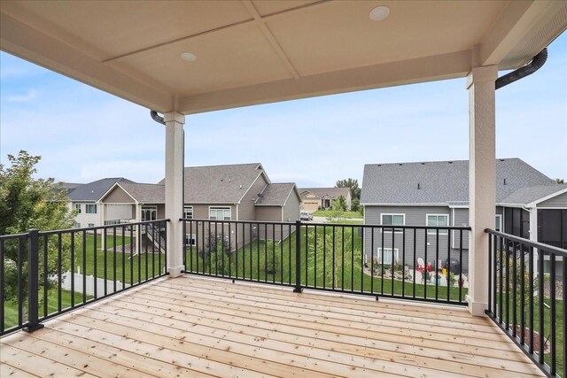 wooden terrace featuring a residential view