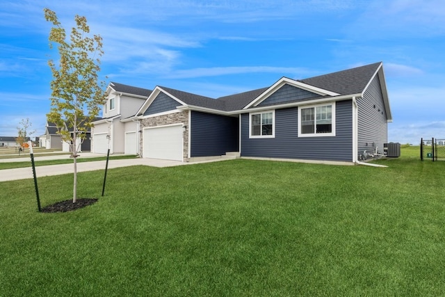 ranch-style house with a garage, a front yard, and cooling unit