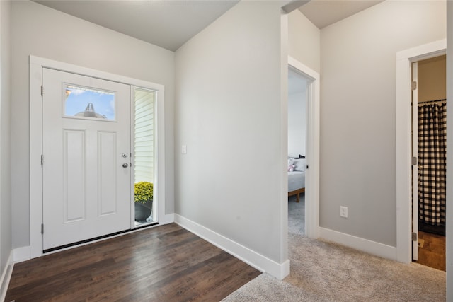 entrance foyer with dark hardwood / wood-style floors