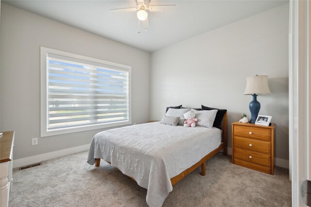 carpeted bedroom with ceiling fan