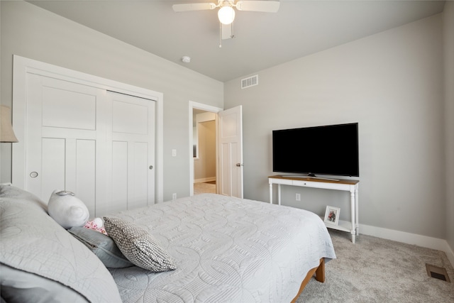 bedroom with light carpet, a closet, and ceiling fan