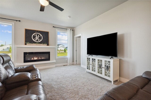 living room featuring carpet flooring and ceiling fan