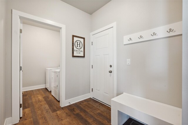 mudroom featuring separate washer and dryer and dark wood-type flooring