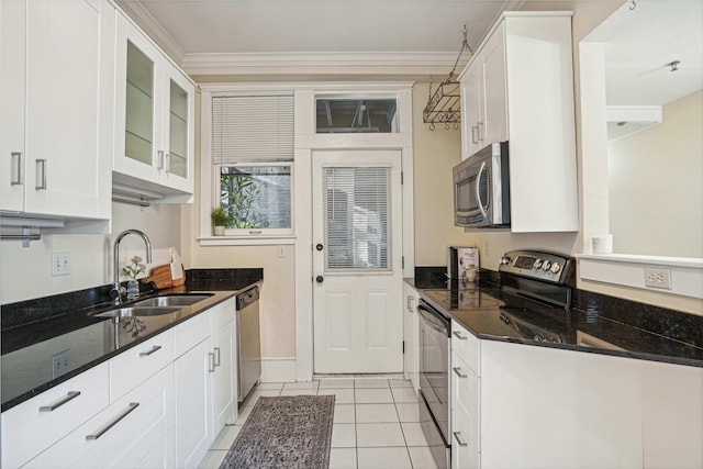 kitchen featuring sink, white cabinets, ornamental molding, and appliances with stainless steel finishes