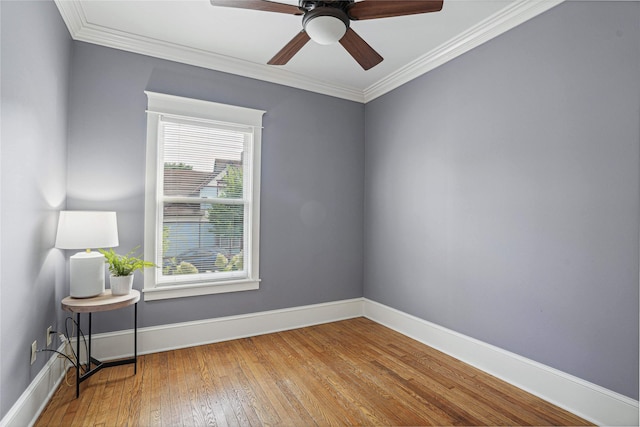 spare room featuring crown molding, ceiling fan, and hardwood / wood-style flooring