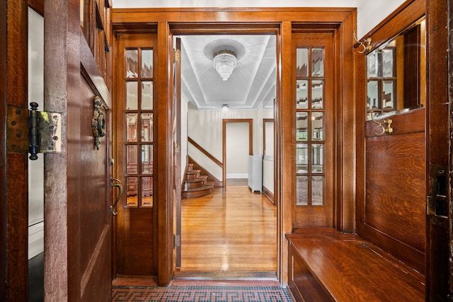 hall with wood-type flooring