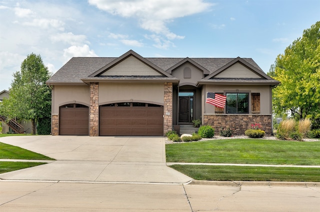 view of front of property featuring a garage and a front yard