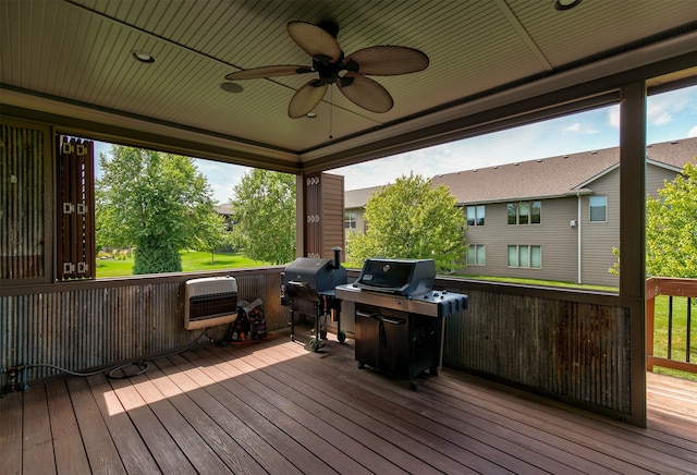 wooden deck with a grill, ceiling fan, and heating unit