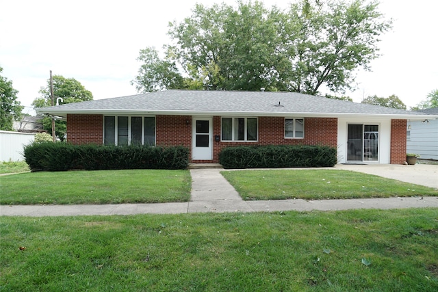 ranch-style home featuring a front yard