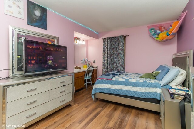 bedroom featuring hardwood / wood-style flooring