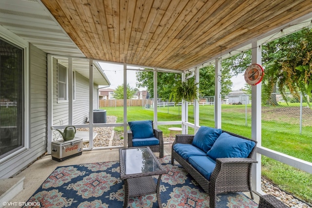 sunroom with wooden ceiling and a healthy amount of sunlight