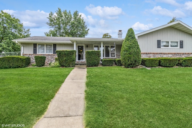 view of front of house with a porch and a front lawn