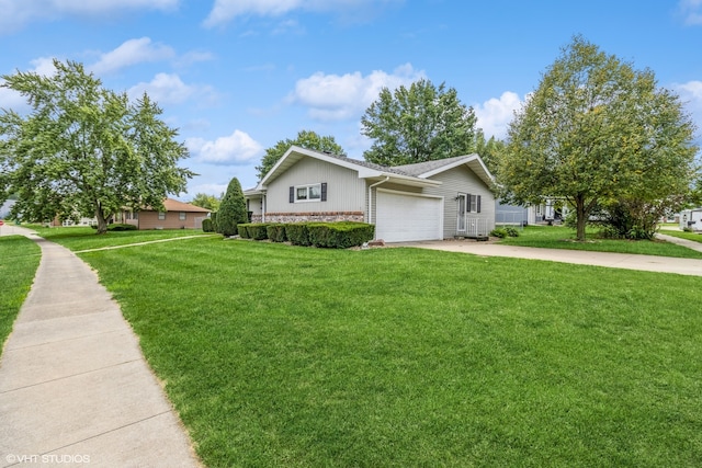 ranch-style home featuring a front yard and a garage