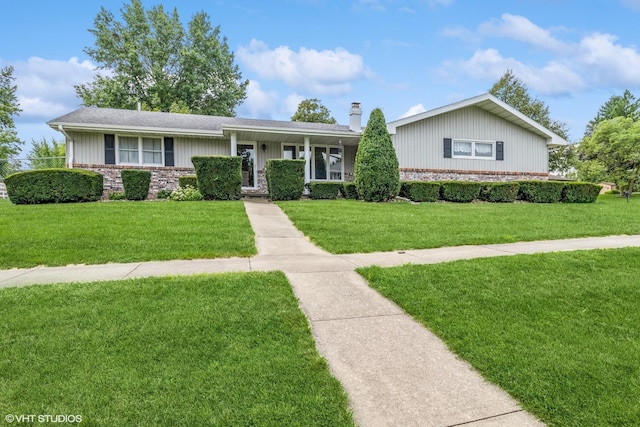 single story home with a front lawn, brick siding, and a chimney