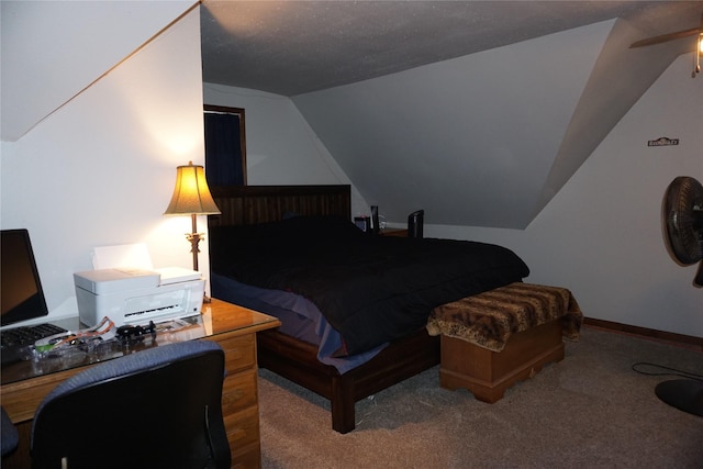 bedroom with vaulted ceiling, carpet flooring, and baseboards