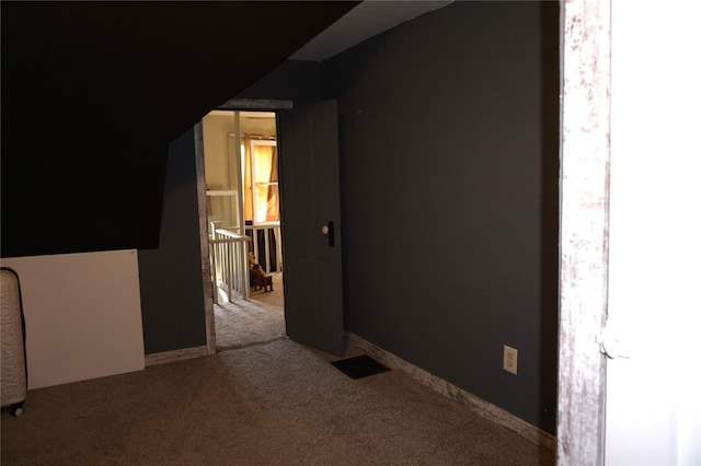 bonus room featuring visible vents and carpet floors