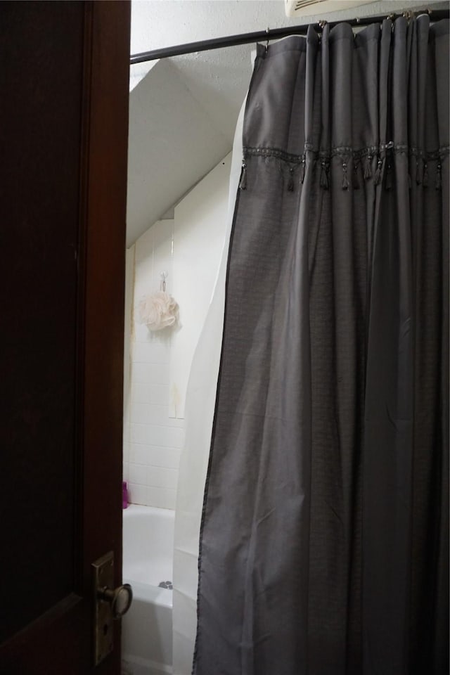 full bathroom featuring shower / tub combo with curtain