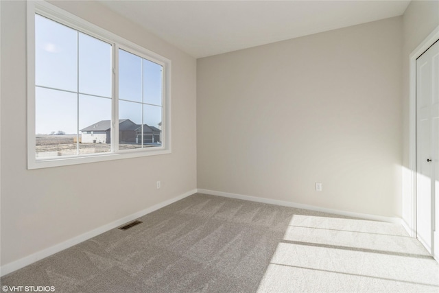 unfurnished room with carpet floors