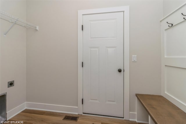 laundry area featuring hardwood / wood-style floors and electric dryer hookup