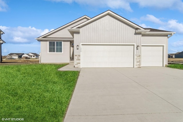 view of front of property with a front lawn and a garage