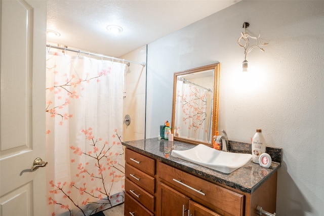 bathroom featuring vanity and walk in shower